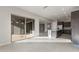 Open kitchen with island and view into Gathering room at 22531 E Orchard Ln, Queen Creek, AZ 85142