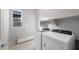Convenient laundry room with Whirlpool washer and dryer at 22531 E Orchard Ln, Queen Creek, AZ 85142