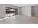 Living area with sliding glass doors opening to the backyard at 22531 E Orchard Ln, Queen Creek, AZ 85142