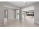 Open living space with tile floors and sliding glass doors leading to backyard at 22531 E Orchard Ln, Queen Creek, AZ 85142