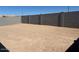 Large dirt backyard enclosed by a block wall at 24592 W Bowker St, Buckeye, AZ 85326