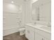 Modern bathroom featuring double sinks, ample counter space, shower-tub combo, and contemporary finishes at 24592 W Bowker St, Buckeye, AZ 85326