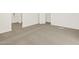 Carpeted bedroom interior featuring neutral decor, closet, and bright sunlight at 24592 W Bowker St, Buckeye, AZ 85326
