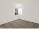 Comfortable carpeted bedroom with a well-lit window and neutral color palette throughout at 24592 W Bowker St, Buckeye, AZ 85326