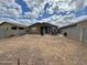 Expansive backyard with a neutral color palette and patio, perfect for outdoor entertaining and relaxation at 5636 W Jackalope Ln, Laveen, AZ 85339