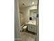 Clean bathroom with tiled floors and a shower with a tan curtain at 5636 W Jackalope Ln, Laveen, AZ 85339