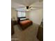 Comfortable bedroom with ceiling fan, carpeted floor, and wood furniture at 5636 W Jackalope Ln, Laveen, AZ 85339