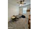 Cozy bedroom with a ceiling fan and natural light at 5636 W Jackalope Ln, Laveen, AZ 85339