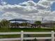 Enjoy the community park featuring a playground and covered seating areas, ideal for Gathering fun and relaxation at 5636 W Jackalope Ln, Laveen, AZ 85339