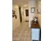 Inviting entryway featuring tile flooring, neutral walls, and a decorative console table with decor at 5636 W Jackalope Ln, Laveen, AZ 85339