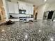 Bright kitchen featuring granite countertops, stainless steel appliances, and a large island with sink at 5636 W Jackalope Ln, Laveen, AZ 85339