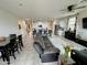 Open living space features tile floors, ceiling fan, and a view into the kitchen at 5636 W Jackalope Ln, Laveen, AZ 85339