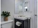 Stylish bathroom featuring a modern vanity with marble countertop and a decorative plant at 7750 E Broadway Rd # 723, Mesa, AZ 85208
