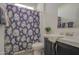 Full bathroom offering a floral shower curtain, updated vanity, and modern fixtures at 7750 E Broadway Rd # 723, Mesa, AZ 85208