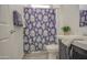 Bathroom featuring a floral shower curtain, vanity, and clean, neutral tones at 7750 E Broadway Rd # 723, Mesa, AZ 85208