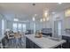 Bright open layout showcasing a kitchen island with dining and living area in the background at 7750 E Broadway Rd # 723, Mesa, AZ 85208