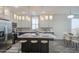 Stylish kitchen featuring an island with seating, stainless steel appliances, and pendant lighting at 7750 E Broadway Rd # 723, Mesa, AZ 85208