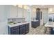 Well-designed kitchen with stainless steel appliances, a center island, and decorative backsplash at 7750 E Broadway Rd # 723, Mesa, AZ 85208
