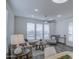 Comfortable living room area featuring modern ceiling fan, plush sofa, and a cozy armchair at 7750 E Broadway Rd # 723, Mesa, AZ 85208