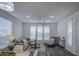 Bright living room with a comfortable sectional sofa, ceiling fan, and natural light through large windows at 7750 E Broadway Rd # 723, Mesa, AZ 85208