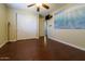 Spacious bedroom with hardwood floors and large closet at 2541 E Carob Dr, Gilbert, AZ 85298
