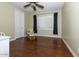 Spacious bedroom with hardwood floors and a large window at 2541 E Carob Dr, Gilbert, AZ 85298