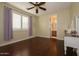 Bright bedroom with wood floors and a view of the bathroom at 2541 E Carob Dr, Gilbert, AZ 85298