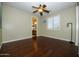 Well-lit bedroom with hardwood floors and access to bathroom at 2541 E Carob Dr, Gilbert, AZ 85298