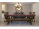 Formal dining room with large table, chandelier, and mirror at 2541 E Carob Dr, Gilbert, AZ 85298