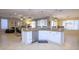 Large kitchen island with seating and granite countertop at 2541 E Carob Dr, Gilbert, AZ 85298