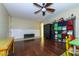 Bright playroom with hardwood floors, built-in storage, and plenty of space for  at 2541 E Carob Dr, Gilbert, AZ 85298