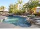 Inviting pool and spa with a cascading waterfall at 2541 E Carob Dr, Gilbert, AZ 85298