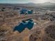 Aerial view of a house on a large lot with surrounding desert landscape at 37611 W San Juan Ave, Tonopah, AZ 85354