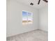 Bright bedroom with a large window offering scenic views at 37611 W San Juan Ave, Tonopah, AZ 85354