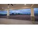 Spacious backyard surrounded by a block wall with a covered patio overlooking the desert landscape at 3888 E Weston Ln, San Tan Valley, AZ 85140