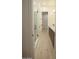 Bright bathroom features a walk-in shower, dual vanity with black hardware, and light wood flooring at 3888 E Weston Ln, San Tan Valley, AZ 85140