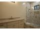 Bathroom featuring marble countertop, modern finishes, and a glass-enclosed shower with tile at 3888 E Weston Ln, San Tan Valley, AZ 85140