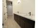 Stylish bathroom with double sinks, marble countertops, and modern fixtures on updated cabinets at 3888 E Weston Ln, San Tan Valley, AZ 85140