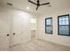 Bright bedroom with wood floors, closet, and multiple windows at 3888 E Weston Ln, San Tan Valley, AZ 85140