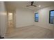 Expansive bedroom with wood floors, ensuite bathroom, and natural light from large windows at 3888 E Weston Ln, San Tan Valley, AZ 85140