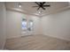 Bedroom with wood tile flooring and access to the backyard at 3888 E Weston Ln, San Tan Valley, AZ 85140