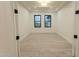 Bedroom with wood tile flooring, tray ceiling and lots of light at 3888 E Weston Ln, San Tan Valley, AZ 85140