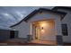 Exterior view showcasing stucco and brick accents, covered entrance, and low landscape at 3888 E Weston Ln, San Tan Valley, AZ 85140