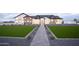 Stunning single-story home with a manicured lawn, stone accents, and a welcoming walkway at 3888 E Weston Ln, San Tan Valley, AZ 85140