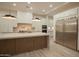 Spacious kitchen featuring stainless steel appliances, island, and modern lighting at 3888 E Weston Ln, San Tan Valley, AZ 85140
