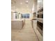Bright kitchen with large island, modern appliances, and wood tile flooring at 3888 E Weston Ln, San Tan Valley, AZ 85140