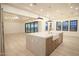 Open-concept kitchen with a farmhouse sink, stainless appliances, and adjacent living areas at 3888 E Weston Ln, San Tan Valley, AZ 85140
