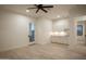 Living room with white cabinets and light filled exterior door, featuring plank flooring at 3888 E Weston Ln, San Tan Valley, AZ 85140