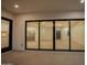 Living room with chandelier that is accessible through large sliding glass doors from the patio at 3888 E Weston Ln, San Tan Valley, AZ 85140