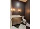 Stylish powder room with elegant fixtures and a contemporary design at 3888 E Weston Ln, San Tan Valley, AZ 85140